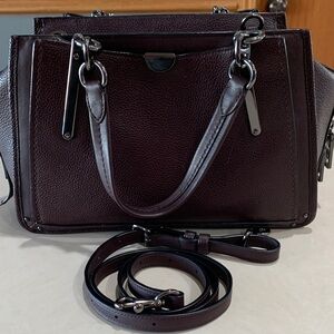 Coach Leather Handbag with shoulder straps.